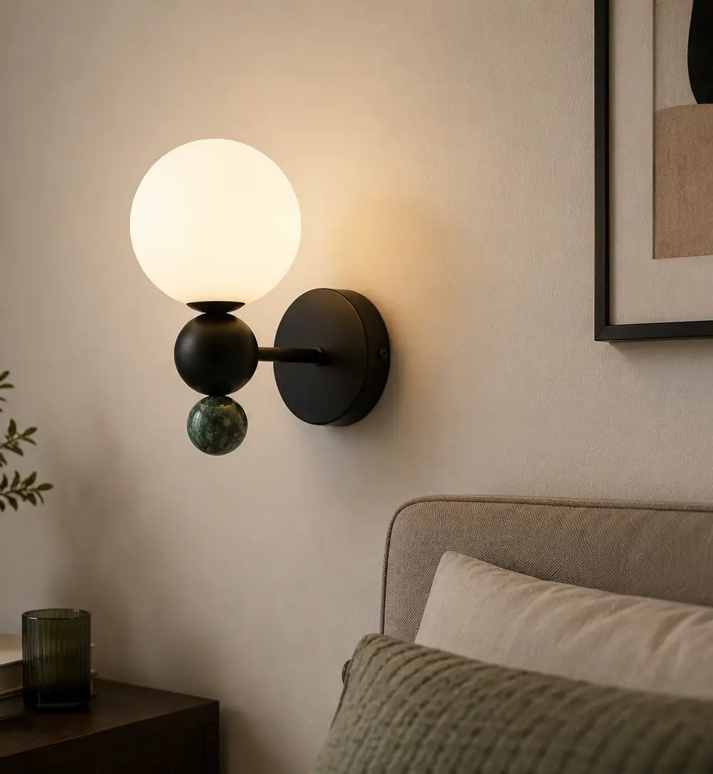 Strong Lighting STB16064-1 contemporary matte black spherical wall lamp featuring a frosted white glass shade and natural green marble sphere base